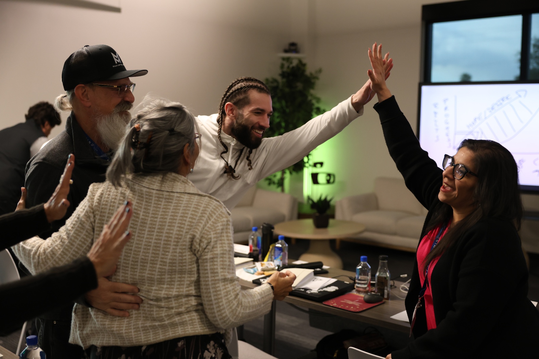 Mario Silot celebrating a workshop breakthrough with attendees